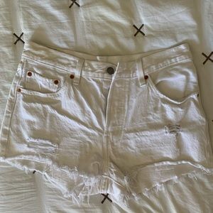 Levi’s 501 white distressed shorts
